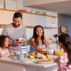 Family talking around the kitchen counter
