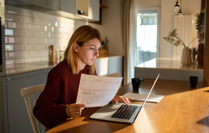 Lady looking at her laptop