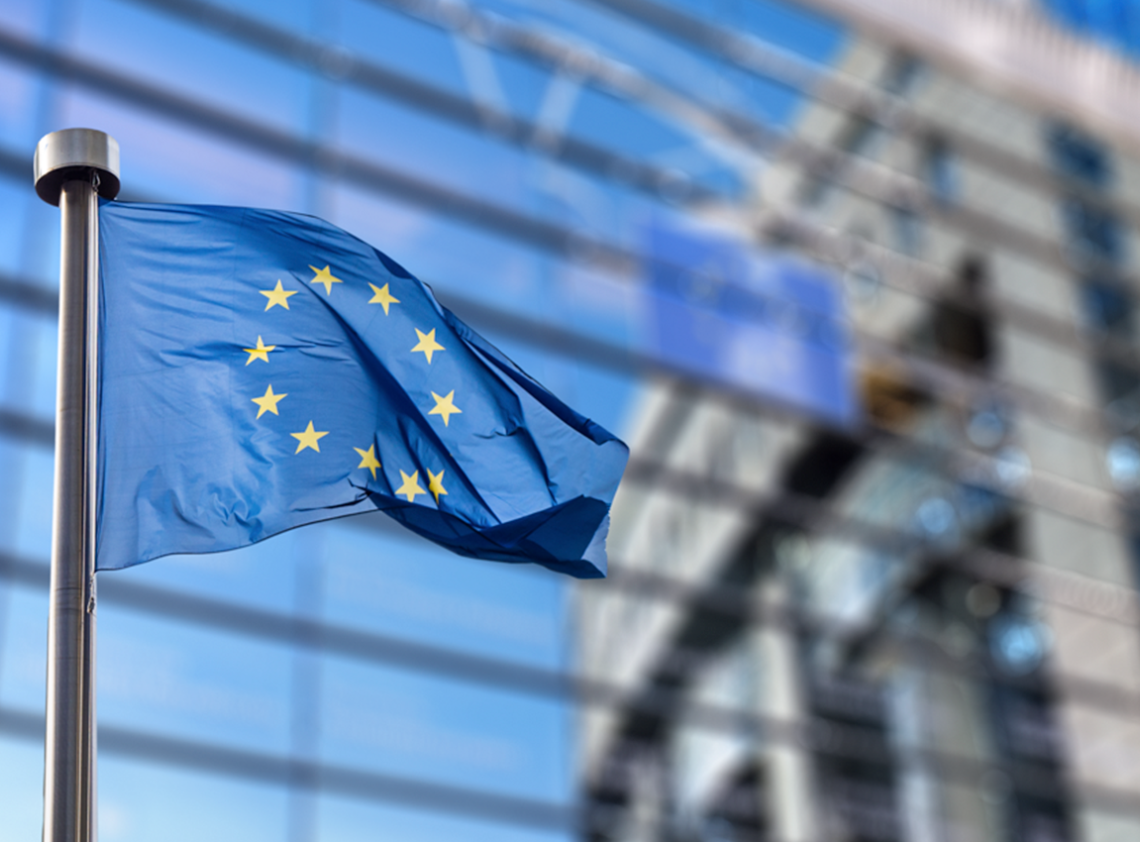 The European Union flag outside of a building